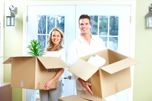 Office furniture and IT items prepared for transport during a local move